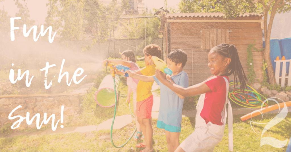 Best Summer activities for kids in Minesota with a picture of kids spraying water on a summer day