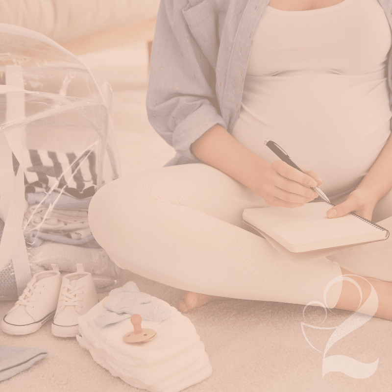 Woman writing down on a list what to pack for a hospital bag