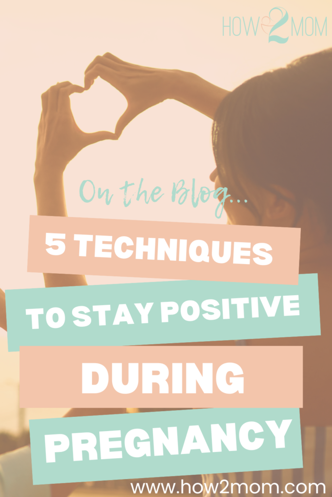 Woman making heart-shape out of hands