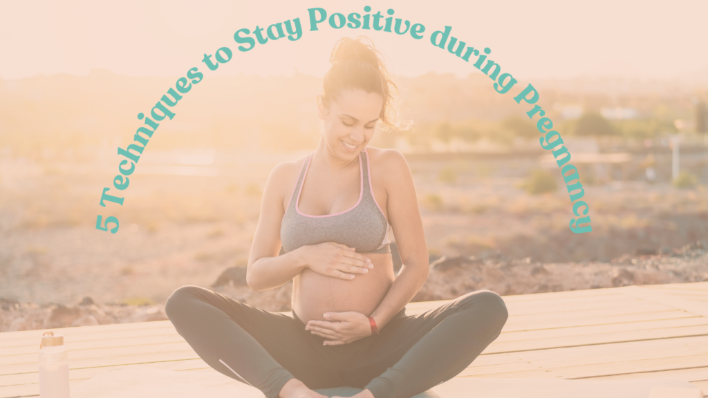 Pregnant mom smiling and practicing yoga