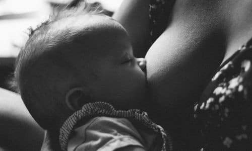 baby breastfeeding while sleeping