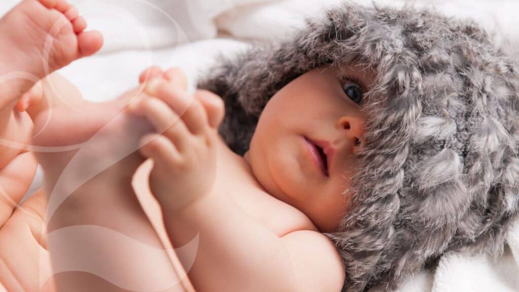 Baby Laying in Crib on How to Sleep Train a 6 Month Old